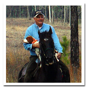 Jim on horse with Brittany in saddle