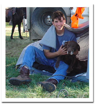 Picture of Jimmy with dog in lap